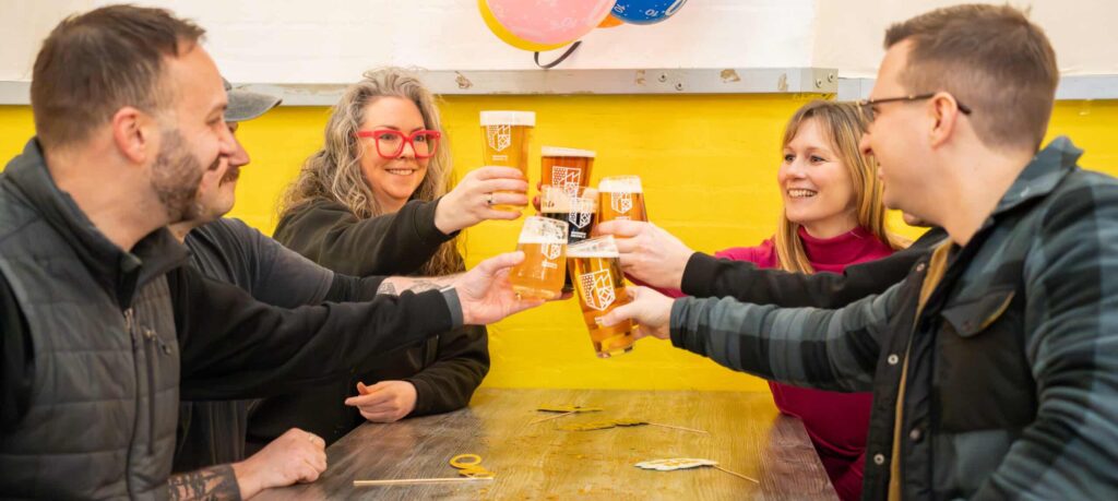 A group of people enjoyning a range of drinks including ales and lagers